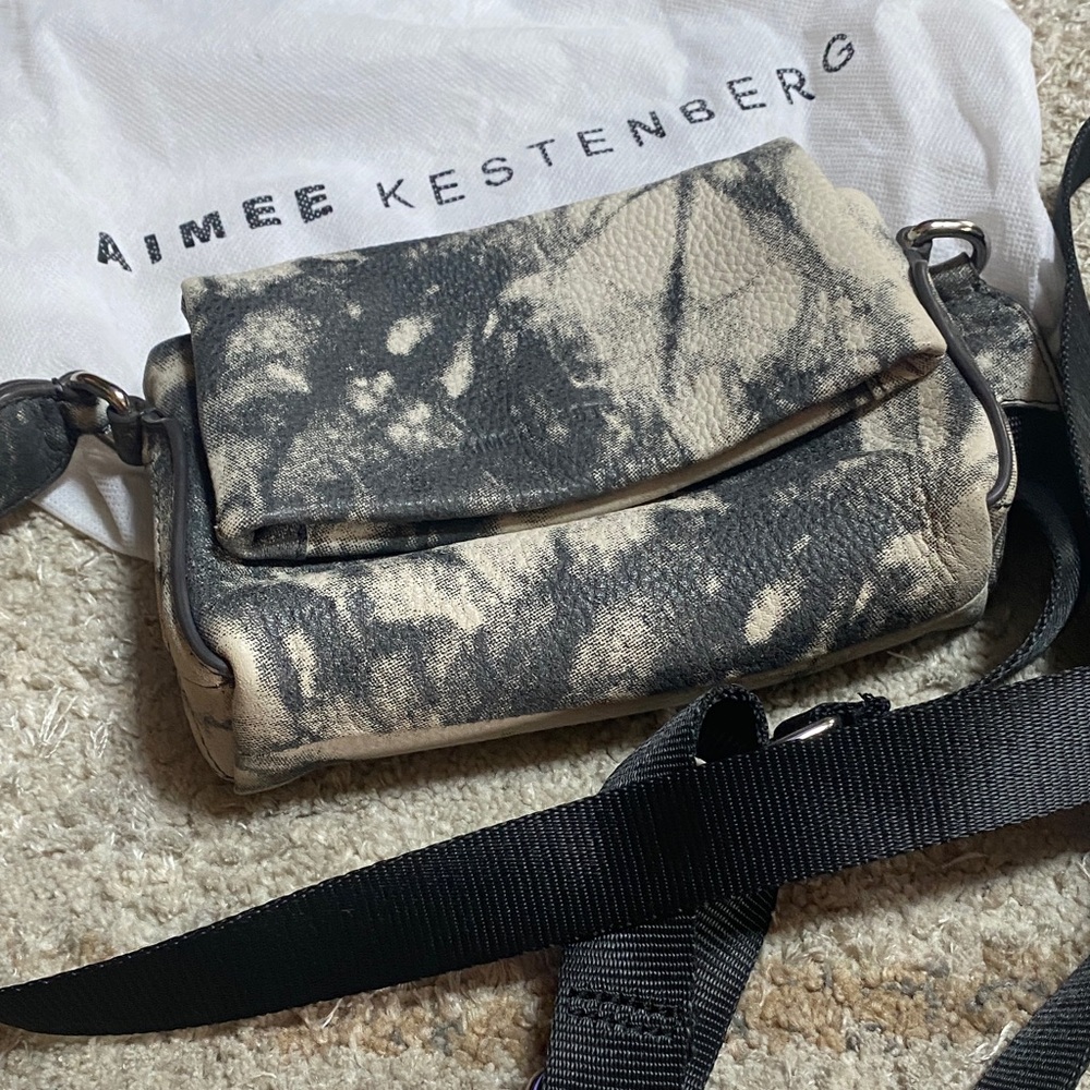 Black and grey cell phone and necessity crossbody mini bag. Never used.perfect